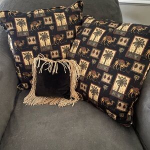 Pillows: :black w/camels/palm trees; 2nd side is black/maroon paisley;sm velvet